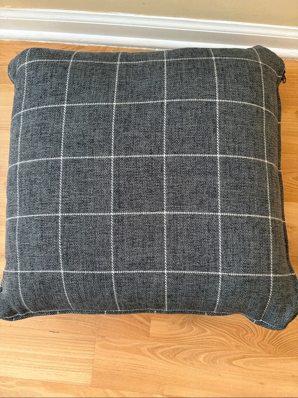 Gray and white checker accent pillow with side zipper.